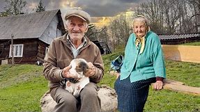 Happy old age of an elderly couple in a mountain village far from civilization
