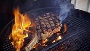 Tomahawk steak on charcoal grill cooked to perfection