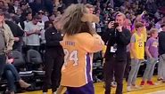 Kings' mascot Bailey plays football with Lakers