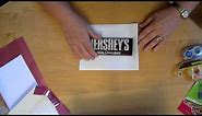 Wrap a 1.66oz Hershey candy bar with a personalized wrapper