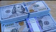 Counting $3,000 in $100 dollar bills