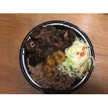Jamaican Cooked Oxtails, Oxtail Meal, Jamaican Foods, Frozen Foods, Native Food, Oxtail Meal, Oxtail With Rice, Plantain And Steamed Cabbage