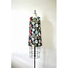 Black Sleeveless Mini Dress With Floral Pattern And Cutout Back