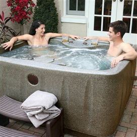 Discover 4-Person 12-Jet Plug & Play Hot Tub W/ LED Waterfall, Powered By Jacuzzi Pumps Plastic Aquarest Spas, Powered By Jacuzzi® Pumps | Wayfair