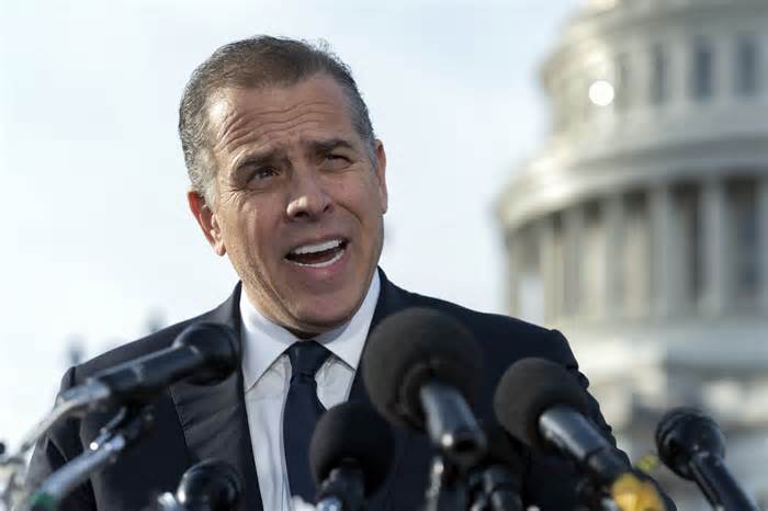 FILE - Hunter Biden, son of President Joe Biden, talks to reporters at the U.S. Capitol, in Washington, Dec. 13, 2023. Alexander Smirnov, a former FBI informant charged with lying about a multimillion-dollar bribery scheme involving President Joe Biden’s family, will appear in a California federal court on Monday, Feb. 26, as a judge considers whether he must remain behind bars while he awaits trial. Special counsel David Weiss’ office is pressing Judge Otis Wright II to keep Smirnov in jail, arguing the man who claims to have ties to Russian intelligence is likely to flee the country. (AP Photo/Jose Luis Magana, File)