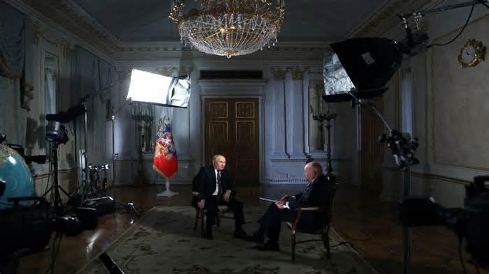 Russian President Vladimir Putin speaks with Director General of Rossiya Segodnya media group Dmitry Kiselyov during an interview in Moscow, Russia, on 12 March, 2024. Reuters File