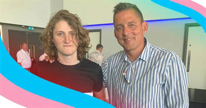 Amelia and Tom are looking to the camera smiling - Amelia is wearing a black t-shirt and Tom is wearing a stripped blue and white shirt. Amelia has shoulder length wavy hair and blue eyes. The photo is framed with trans pride colours.