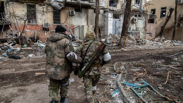 Russian and Chechen soldiers in a devastated Mariupol neighborhood close to the Azovstal frontline. The battle between Russian / Pro Russian forces and the defending Ukrainian forces led by the Azov battalion continues in the port city of Mariupol. (Photo by Maximilian Clarke/SOPA Images/LightRocket via Getty Images)