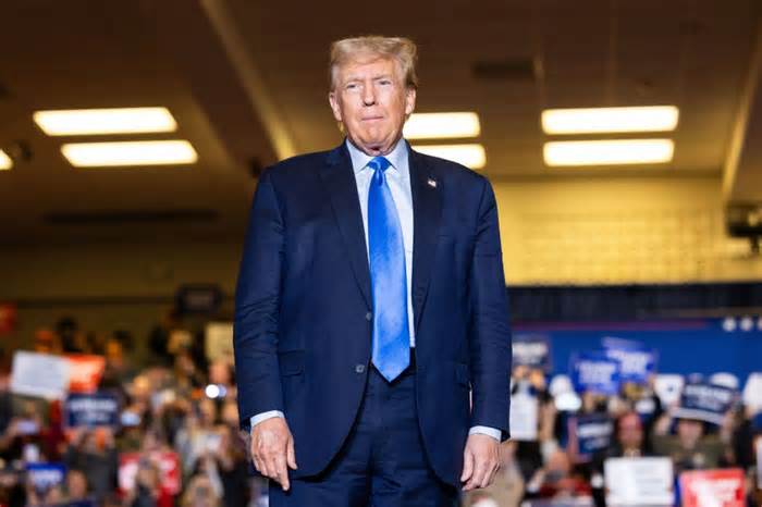 Republican presidential candidate former President Donald Trump stands on stage before delivering remarks during a campaign event, Nov. 11, 2023, in Claremont, N.H.