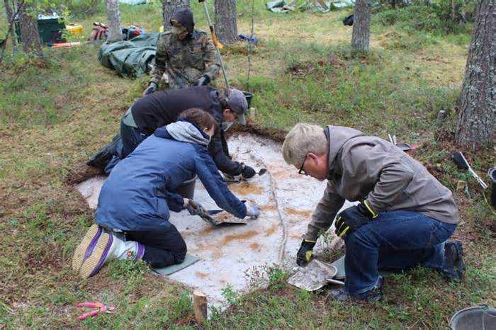 Archaeologists excavating the Tainiaro site