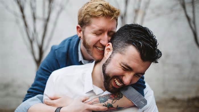 Matt Napolitano, right, and his husband, Ricky Whitcomb, share a moment of joy in celebration of their wedding.
