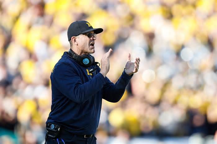 Michigan coach Jim Harbaugh reacts to a play against Alabama during the first half of the Rose Bowl.