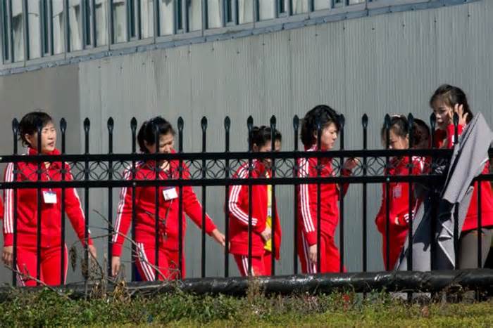 North Korean workers gather after lunch at the Hong Chao Zhi Yi garment factory in Hunchun, Jilin province, China, in this Sept. 30, 2017 photo. An official at South Korea's National intelligence agency told The Korea Times, Monday, that 'accidents' involving North Korean workers overseas occurred recently due to poor working conditions. This confirmation comes after a scholar claimed at least one North Korean official was killed as a result of protests that erupted in China. AP-Yonhap