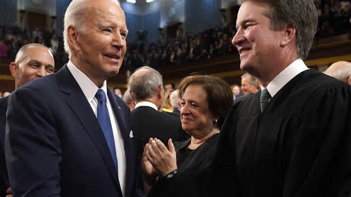 President Joe Biden greets Supreme Court Justice Brett Kavanaugh before delivering the State of the Union address on February 7, 2023, in Washington, DC.