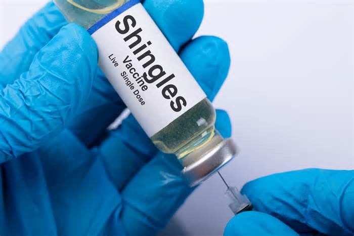 Close-up Of A Doctor's Hand Filling Shingles Vaccine Syringe