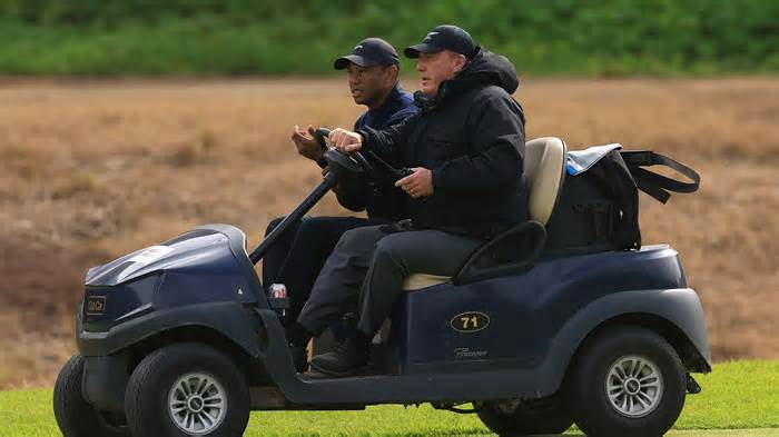 Tiger Woods was carted off the golf course Friday.