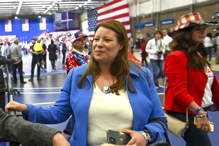 Stefanie Lambert attends a rally for Republican candidates at the Macomb Community College Sports & Expo Center in Warren, Mich., Oct. 1, 2022. The attorney facing criminal charges for illegally accessing Michigan voting machines after the 2020 election was arrested Monday, March 18, 2024 after a hearing in a separate case in federal court in Washington, D.C. (Todd McInturf/Detroit News via AP)