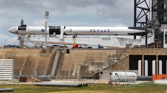 The Space X Demo-2 Falcon 9 rocket, with the Crew Dragon capsule (far left), lies horizontal at Launch Pad 39-A at Kennedy Space Center on Tuesday, May 26, 2020.