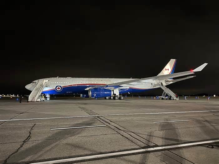 Airbus 02 waits to take on passengers before dawn at the Canada Reception Centre at Ottawa/Macdonald–Cartier International Airport on November 15, 2023.