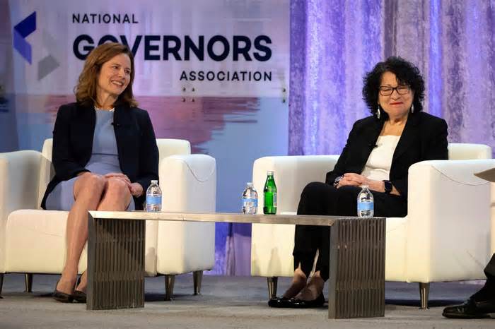 Supreme Court Justices Amy Coney Barrett, left, and Sonia Sotomayor speak during a panel discussion at the winter meeting of the National Governors Association, Friday, Feb. 23, 2024 in Washington.