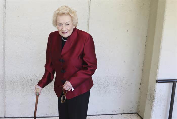 FILE - Native Hawaiian heiress Abigail Kawānanakoa poses outside a Honolulu courthouse on Oct. 25, 2019. There will be at least $100 million leftover to fund Native Hawaiian causes from the estate of the so-called last Hawaiian princess who died last year at age 96. According to court documents filed last week in the probate case for the estate of Abigail Kawānanakoa, $40 million will go to her wife. (AP Photo/Jennifer Sinco Kelleher, File)