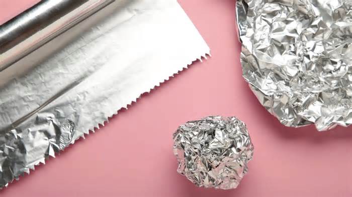 Aluminum foil on pink background
