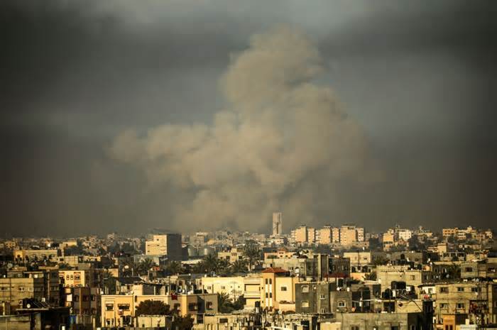 Smoke billows during Israeli bombardment over Khan Yunis in the southern Gaza Strip, on Monday, the same day 21 Israeli soldiers were killed when a building they were in collapsed following an explosion.