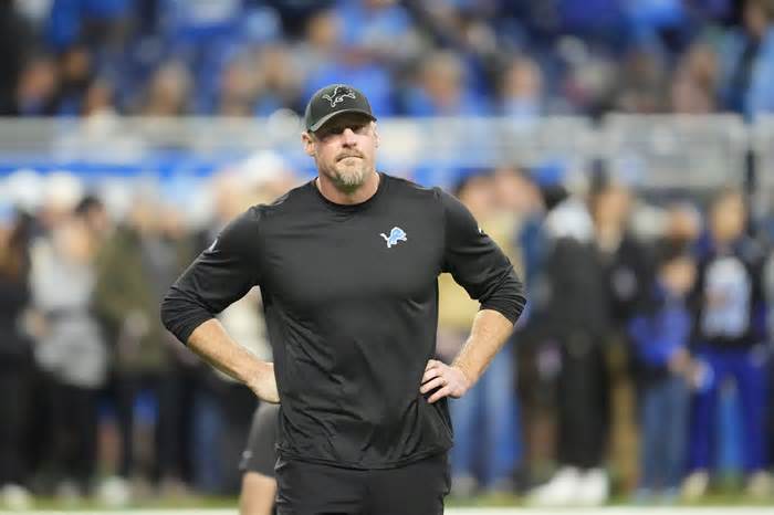 Detroit Lions head coach Dan Campbell walks on the field during pregame of an NFL wild-card playoff football game against the Los Angeles Rams, Sunday, Jan. 14, 2024, in Detroit. (AP Photo/Paul Sancya)