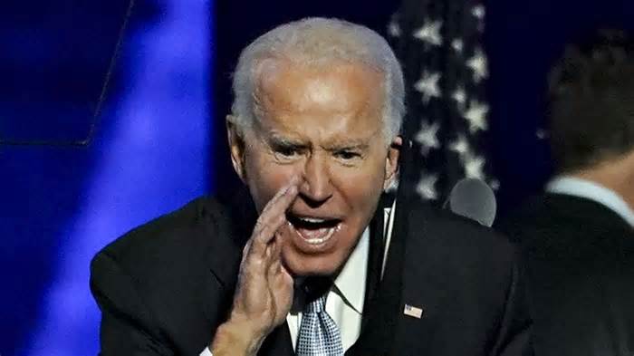 U.S. President-elect Joe Biden yells to the audience after speaking during an election event in Wilmington, Delaware, U.S., on Saturday, Nov. 7, 2020. Biden defeated Donald Trump to become the 46th U.S. president, unseating the incumbent with a pledge to unify and mend a nation reeling from a worsening pandemic, faltering economy and deep political divisions. Photographer: Sarah Silbiger/Bloomberg via Getty Images