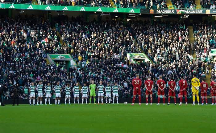 Celtic and Aberdeen players take part in a minutes silence for Remembrance Day during the cinch Premiership match at Celtic Park, Glasgow