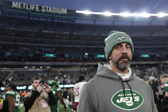 New York Jets quarterback Aaron Rodgers walks off the field after an NFL football game between the New York Jets and the Washington Commanders, Sunday, Dec. 24, 2023, in East Rutherford, N.J. (AP Photo/Adam Hunger)