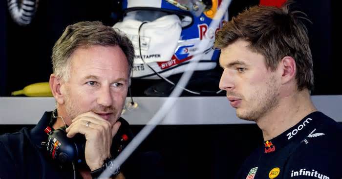 Christian Horner and Max Verstappen in the Red Bull garage.