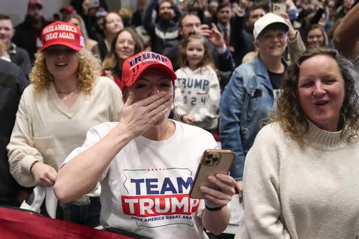 Supporters react as Republican presidential candidate former President Donald Trump arrives to speak at a rally at Simpson College in Indianola, Iowa, Sunday, Jan. 14, 2024. (AP Photo/Andrew Harnik)