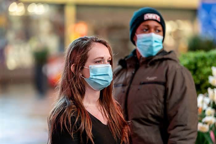 Residents wear masks in Times Square