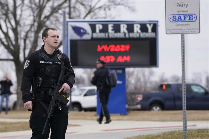 Police respond to a shooting at Perry High School in Perry, Iowa, on Jan. 4, 2024.