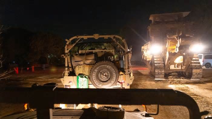 Soon after crossing the border into Gaza, the convoy of Humvees turned off its lights and traveled in darkness. - Oren Liebermann/CNN