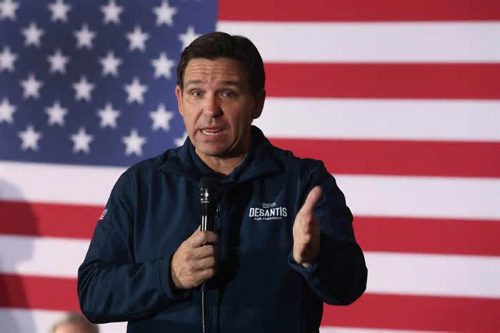 Republican presidential candidate Florida Governor Ron DeSantis speaks to guests during a campaign rally at the Thunderdome on December 02, 2023 in Newton, Iowa.