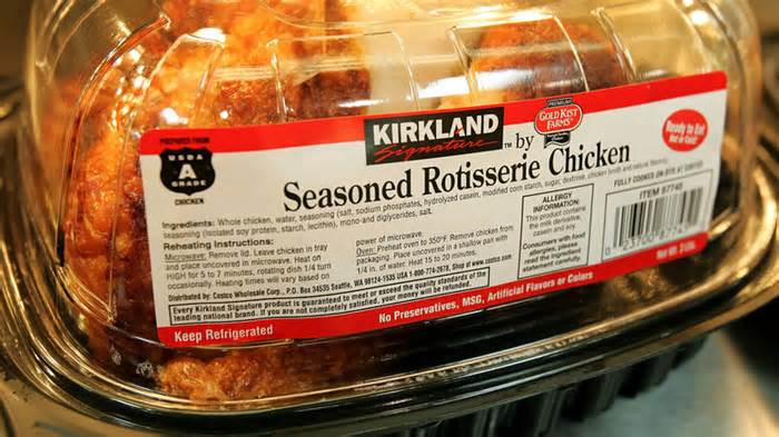 Closeup of a Kirkland Signature rotisserie chicken in plastic packaging