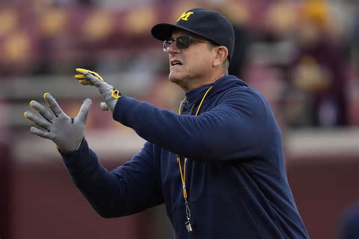 Jim Harbaugh will not coach the final two games of the regular season after Michigan and the Big Ten resolved their litigation Thursday. (Abbie Parr/AP)