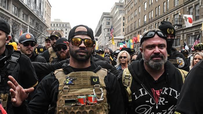 WASHINGTON, DC - DECEMBER 12: Enrique Tarrio, leader of the Proud Boys (L) and Joe Biggs (R) gather outside of Harry's bar during a protest on December 12, 2020 in Washington, DC. Thousands of protesters who refuse to accept that President-elect Joe Biden won the election are rallying ahead of the electoral college vote to make Trump's 306-to-232 loss official.