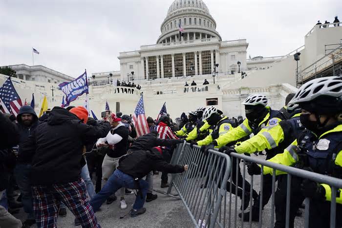 FILE - Rioters supporting President Donald Trump try to break through a police barrier at the Capitol in Washington, on Jan. 6, 2021.(AP Photo/Julio Cortez, File) (Photo: via Associated Press)