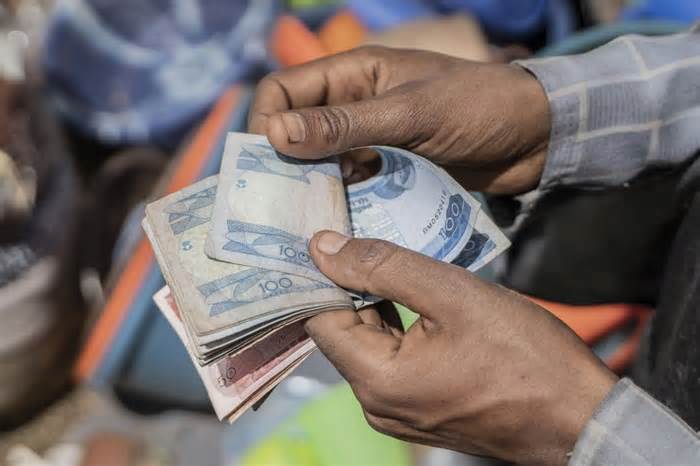 A vendor counts out Ethiopian birr currency