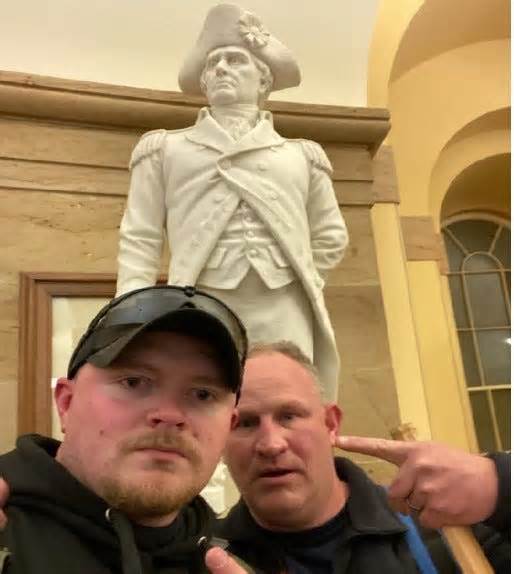Jacob Fracker and Thomas Robertson, two off-duty police officers with the city of Rocky Mount, Virginia, are pictured inside the U.S. Capitol during the deadly Jan. 6 riot, in this photo released by the U.S. Department of Justice.