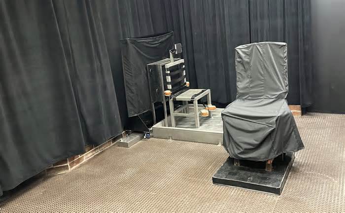 FILE - This photo provided by the South Carolina Department of Corrections shows the state's death chamber in Columbia, S.C., including the electric chair, right, and a firing squad chair, left. The South Carolina Supreme Court appears to be pausing executions until they can hear arguments in February 2024 over whether a law in constitutional that allows the state to keep secret the suppliers of lethal injection drugs and the procedure used to kill inmates. (South Carolina Department of Corrections via AP, File)