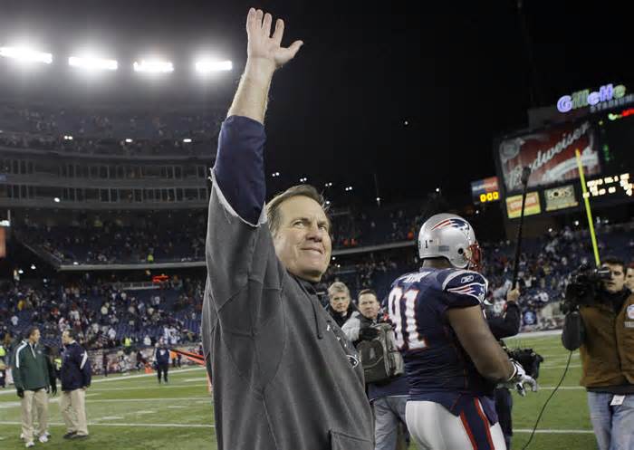 FILE - New England Patriots coach Bill Belichick waves to fans after the Patriots beat the New York Jets 31-14 in an NFL football game in Foxborough, Mass., Sunday Nov. 22, 2009. Six-time NFL champion Bill Belichick has agreed to part ways as the coach of the New England Patriots on Thursday, Jan. 11, 2024, bringing an end to his 24-year tenure as the architect of the most decorated dynasty of the league’s Super Bowl era, a source told the Associated Press on the condition of anonymity because it has not yet been announced. (AP Photo/Elise Amendola, File)