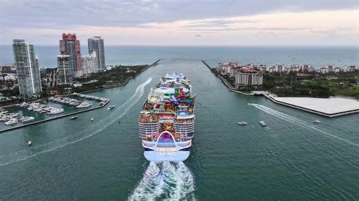 As Icon of the Seas, the crown jewel of Royal Caribbean's fleet and the world's biggest cruise ship embarked on its highly anticipated maiden voyage from the Port of Miami, marking the beginning of a new era in luxury cruising. As the nearly 1,200-foot-long and 250,800 gross ton vessel set sail just before sunset, it captured the imagination of onlookers with its towering presence resembling a multilayered birthday cake. The ship's architectural grandeur, highlighted by its distinctive parabolic bow, promised passengers an extraordinary journey that seamlessly blends opulence, innovation, and breathtaking oceanic vistas. (Image: AP)