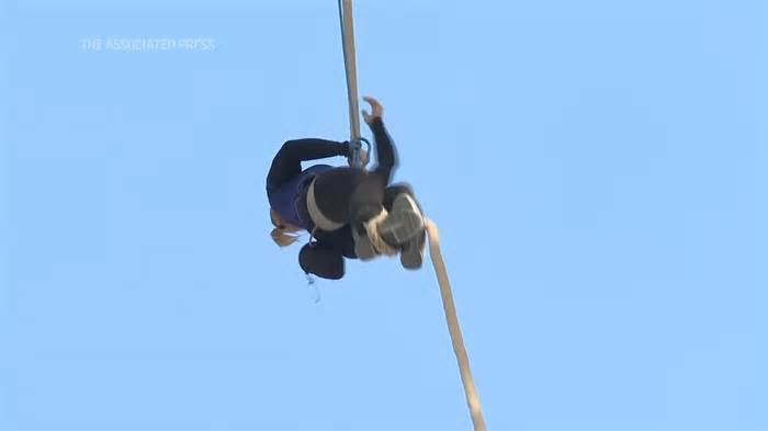 Athlete climbs the Eiffel Tower with a rope to set new world record