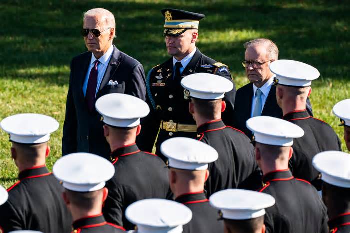 President Biden and Prime Minister Anthony Albanese of Australia review a line of service members outside the White House on Wednesday.