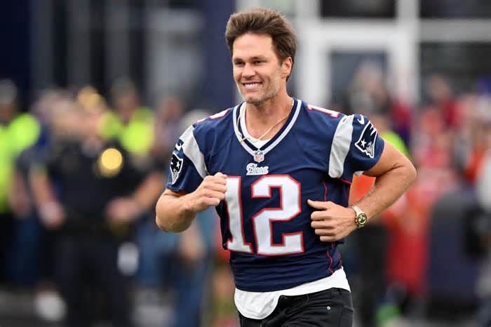 Sep 10, 2023; Foxborough, Massachusetts, USA; New England Patriots former quarterback Tom Brady runs on the field during a halftime ceremony in his honor during the game between the Philadelphia Eagles and New England Patriots at Gillette Stadium. Mandatory Credit: Brian Fluharty-USA TODAY Sports