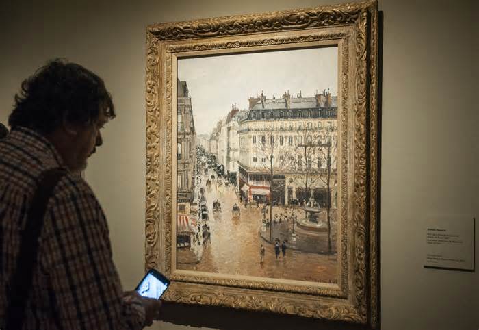 Camille Pissarro's Rue Saint-Honoré in the Afternoon, Effect of Rain (1897) hangs at the Thyssen-Bornemisza Museum in Madrid.